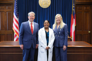 Dr. Dhruti Contractor with Governor Brian Kemp and First Lady Marty Kemp at the Georgia State Capitol