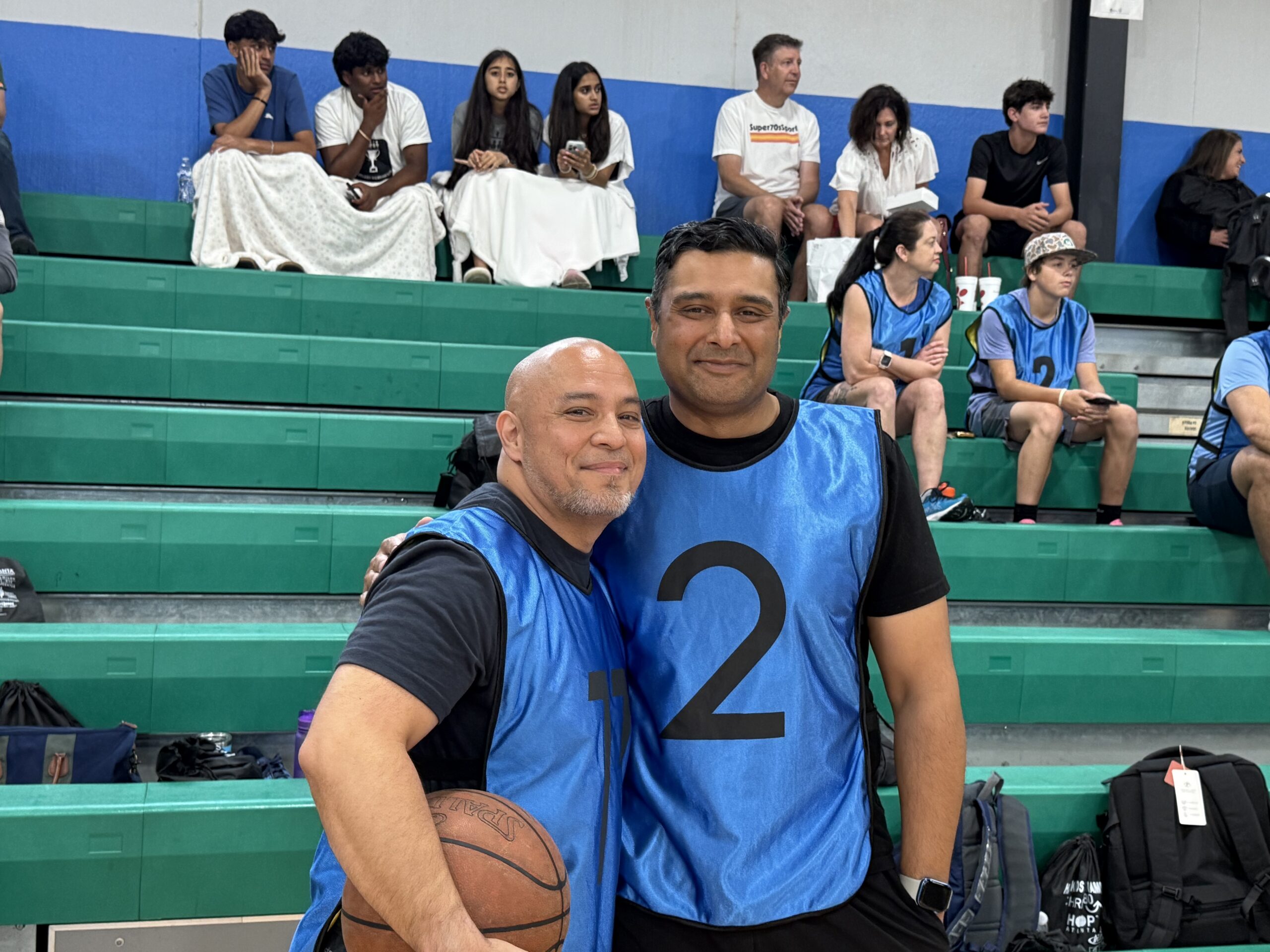 Volunteers at the Happy Kids Tournaments banner