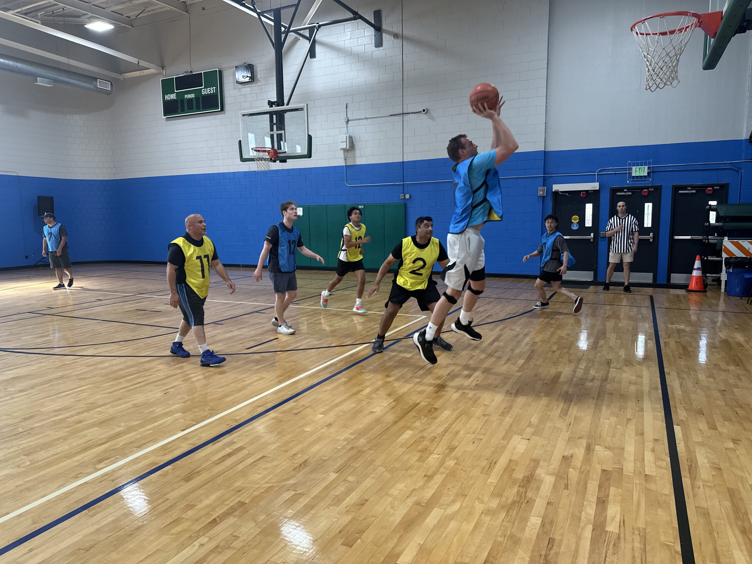 Basketball game action at the Happy Kids Tournaments charity event